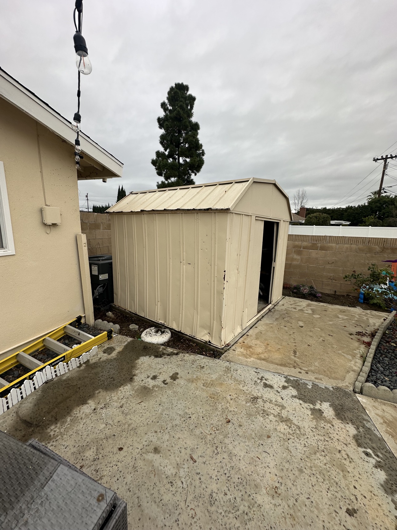 Exterior view of a real Fullerton shed removal project before loading