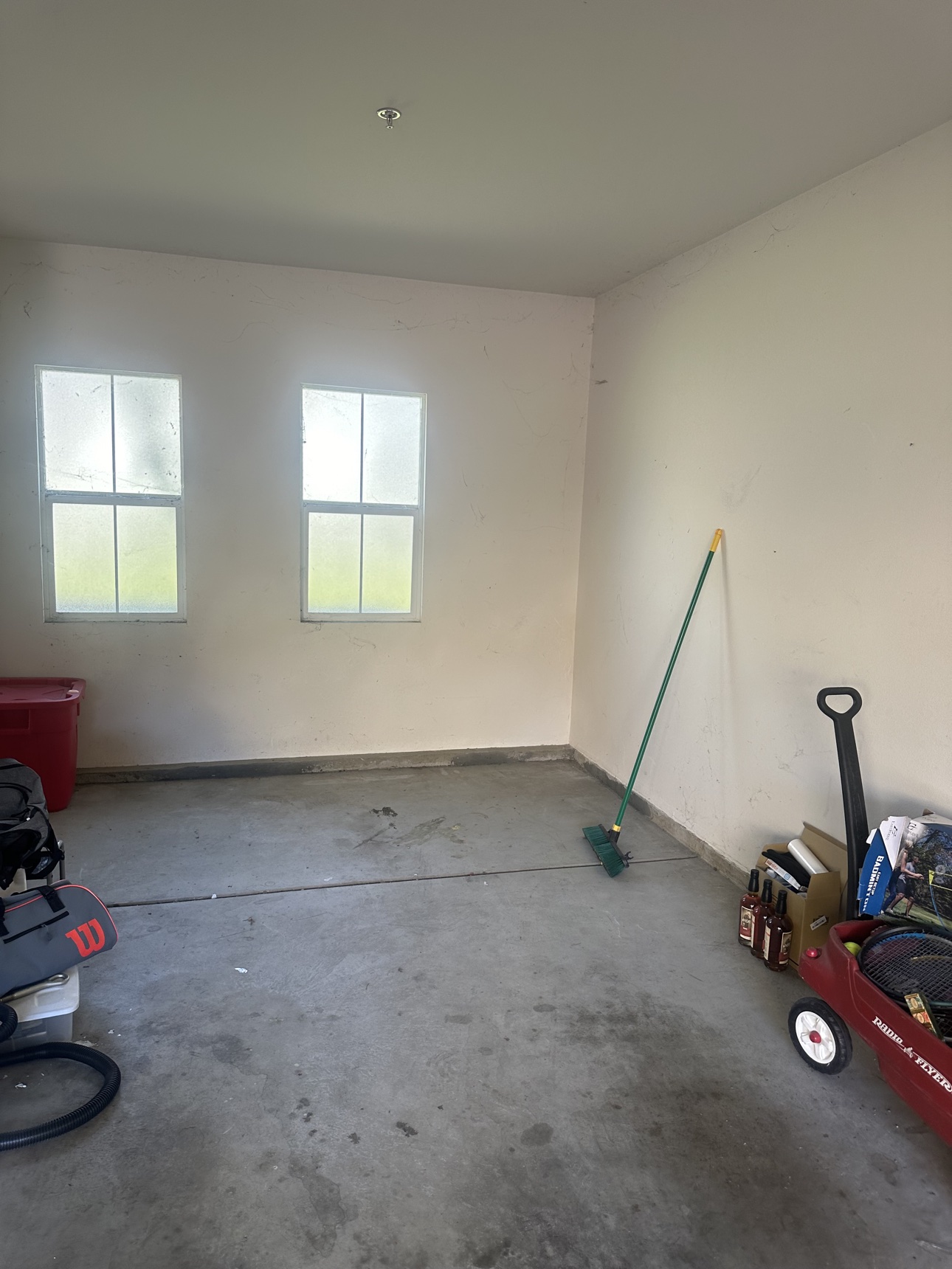 After: open, swept Anaheim garage with a broom after Delta completed the cleanout