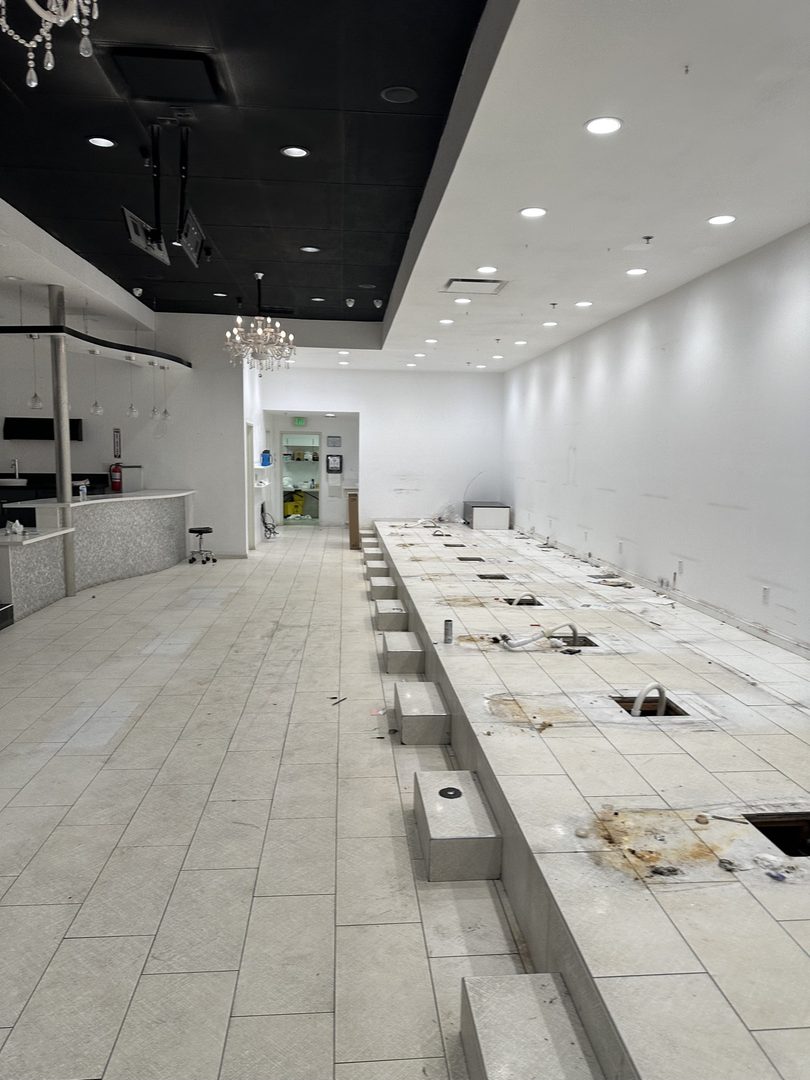 After: salon floor cleared after Delta's commercial cleanout in Westminster, California
